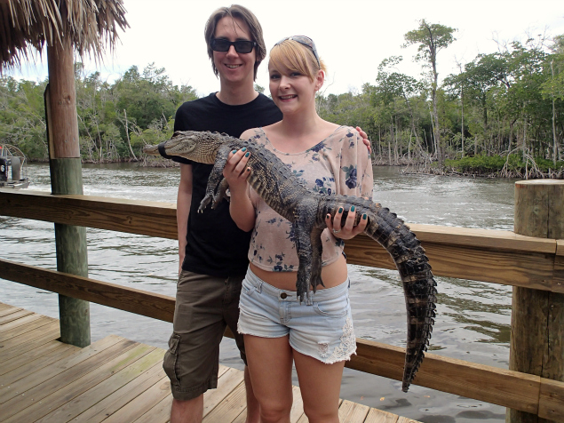 holding an alligator